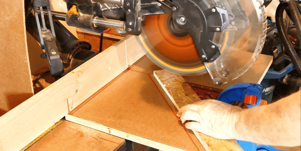 Sliding compound mitre saw with zero clearance fence fitted to it